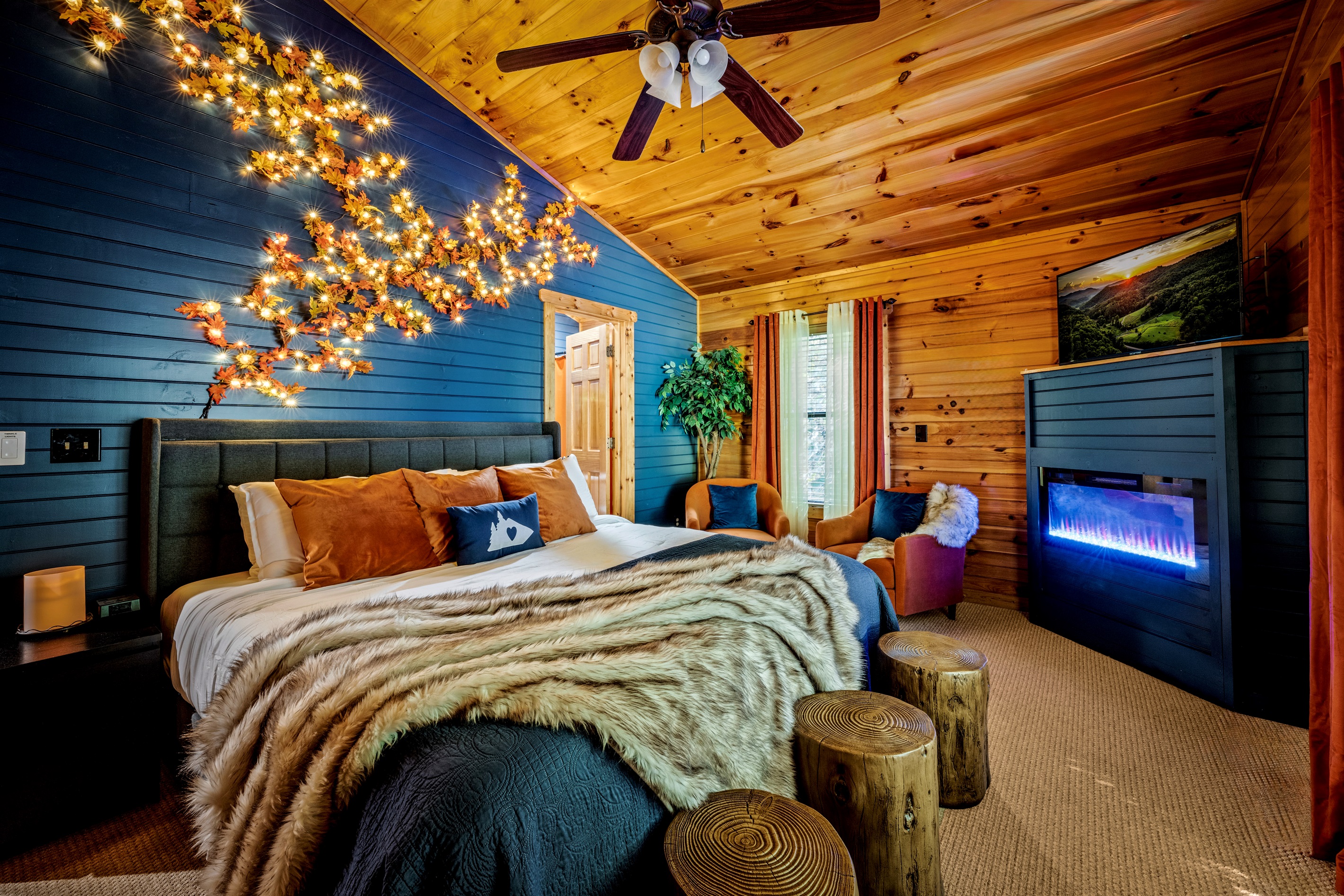 Master en-suite bedroom with attached bathroom. King bed, seating, fireplace vibes, and roku streaming TV.