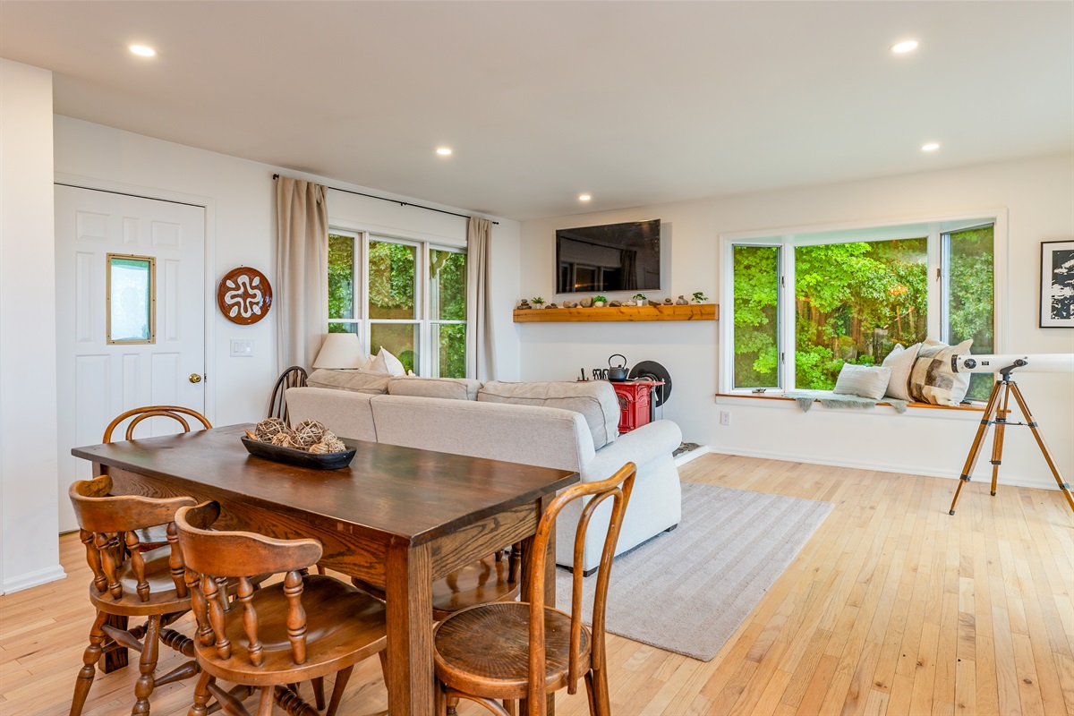 Cozy dining meets functional design in this open-concept common area.