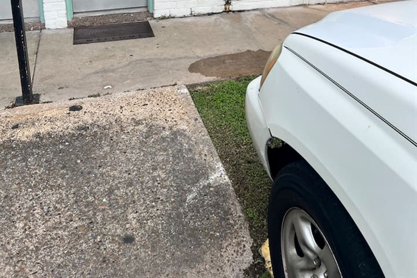 Parking area near the unit with open spaces and a short walk to the front door.

