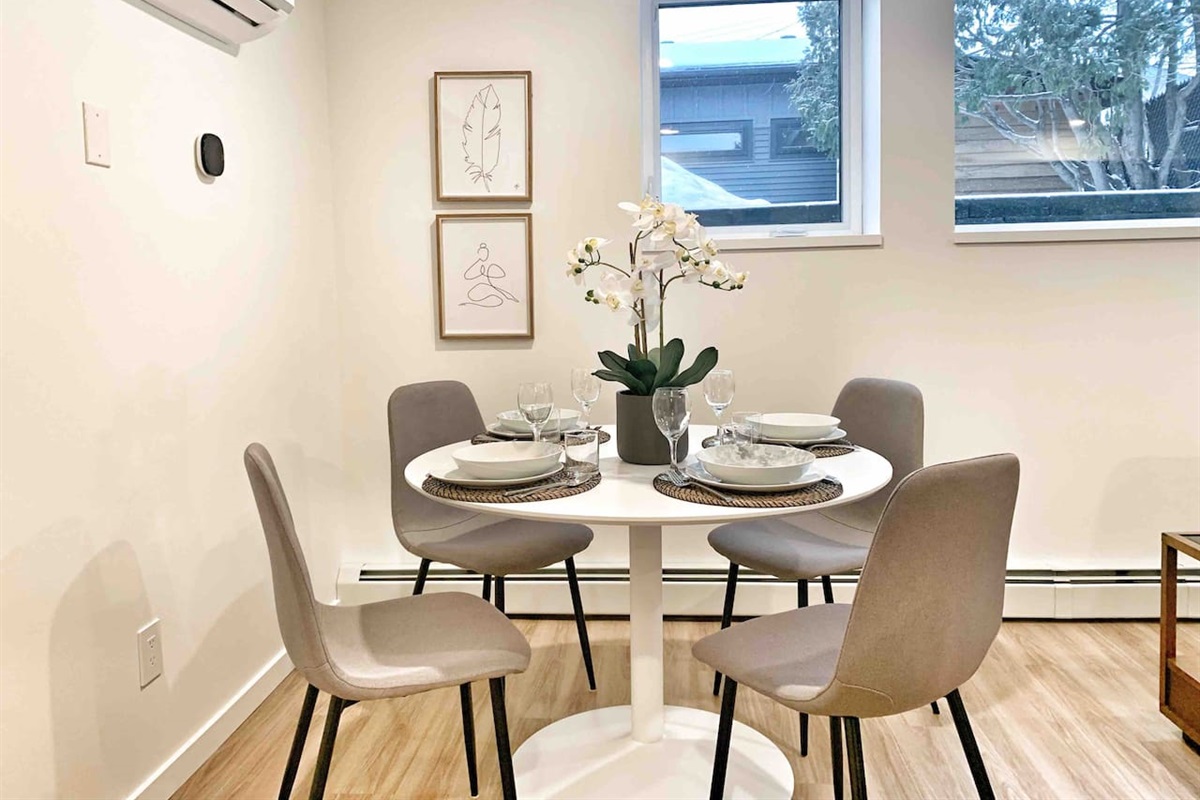 Dining area with seating for four — a comfortable spot for meals, coffee, or planning the day. 
