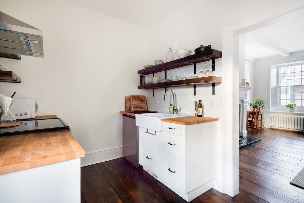 Counter space and open shelving in the kitchen
