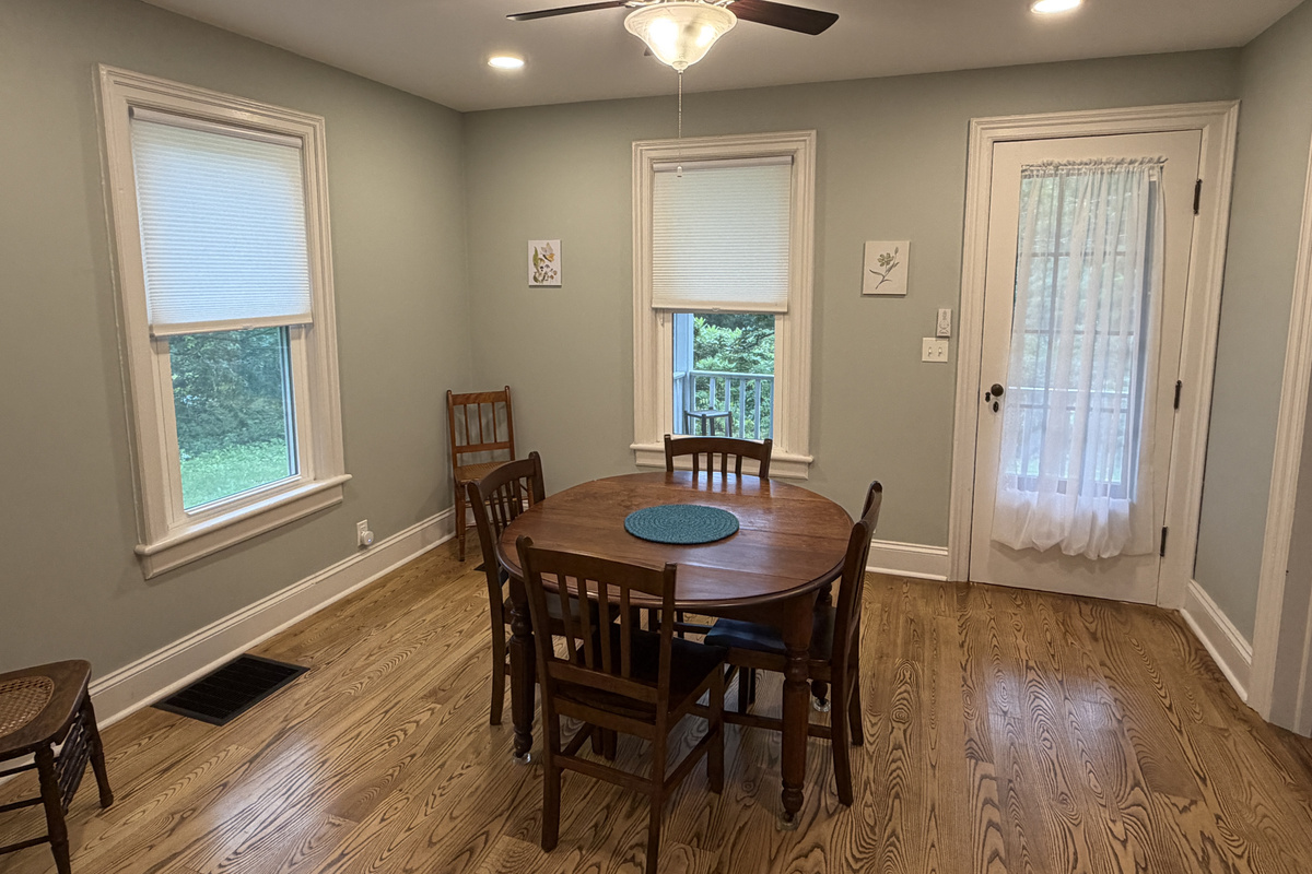 Dining area with door to covered front porch