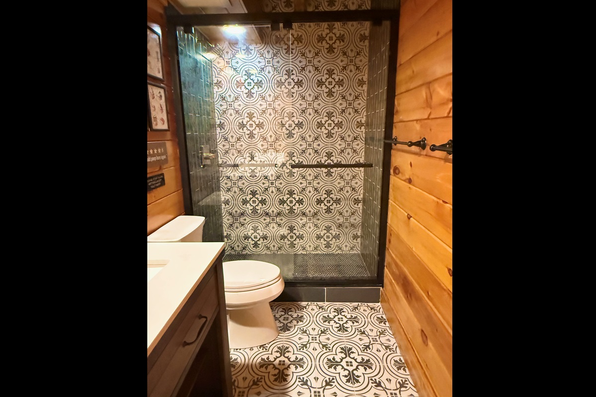 Shower in common bathroom on the main level