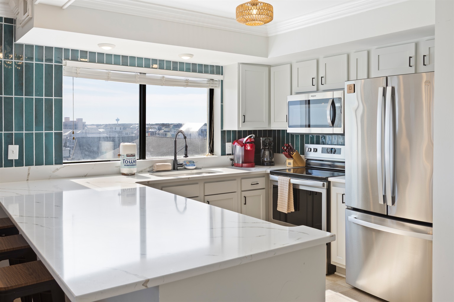 Well stocked kitchen with stainless steel appliances