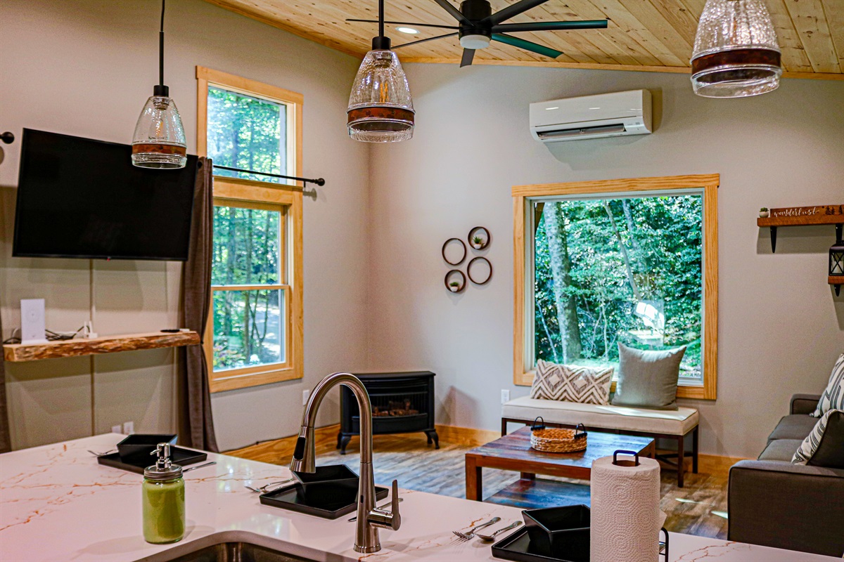 Our Spacious living room and bar area. The trees just seem to come inside the cabin!