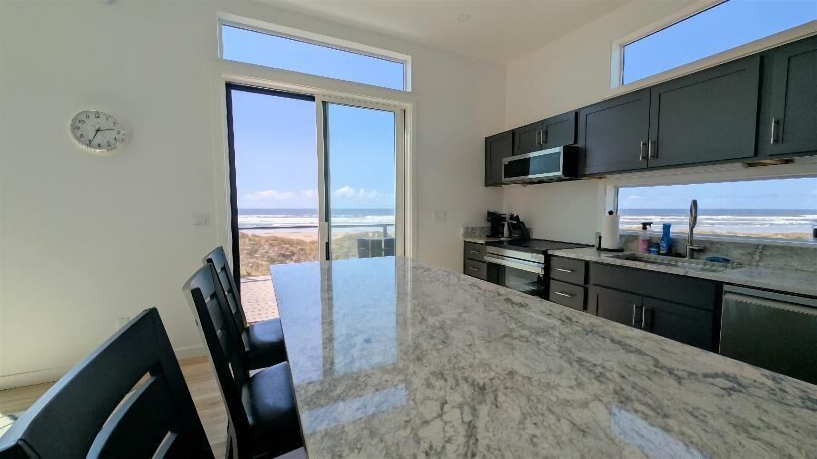 Kitchen with island and seats for 3