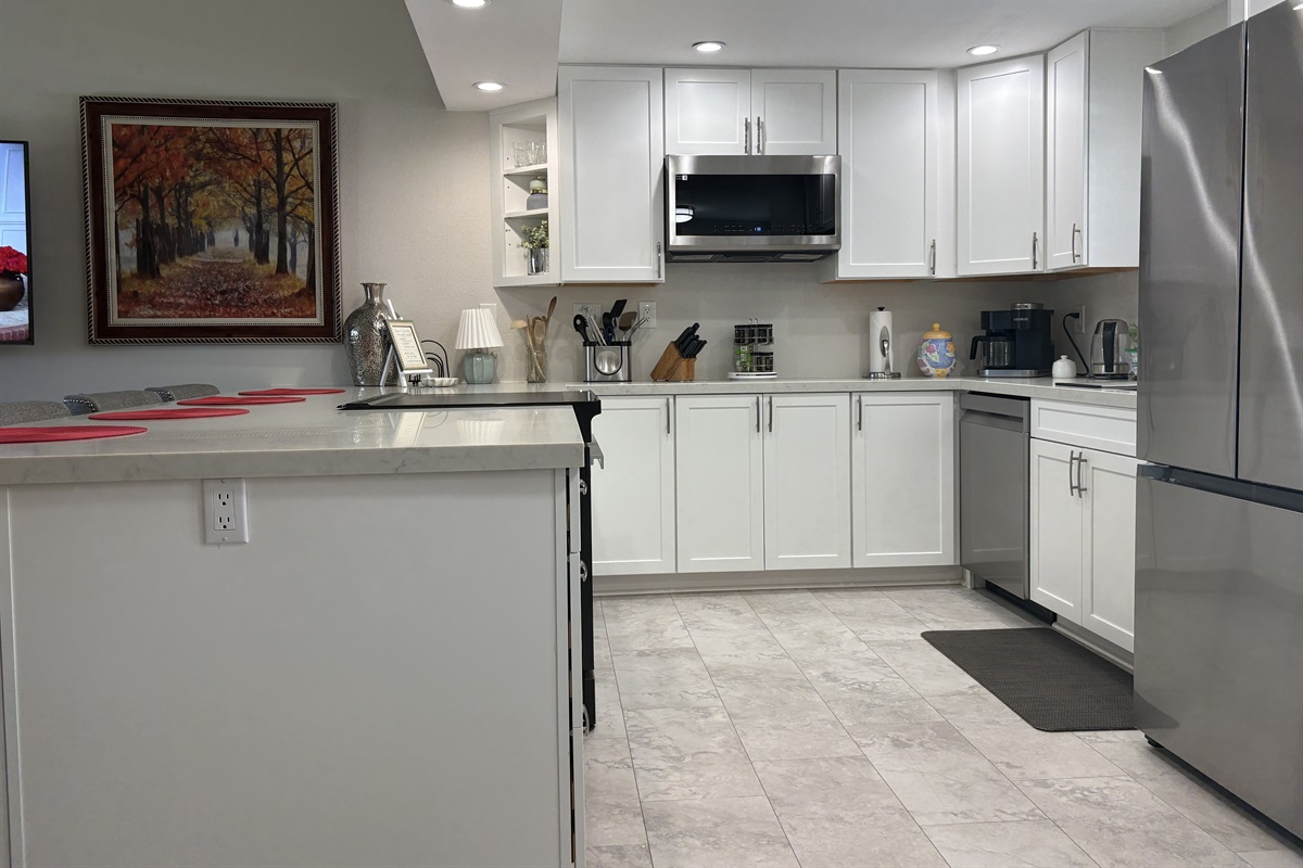 The brand new large kitchen is fully equipped for home cooking  & all your entertaining needs with a BBQ on the patio.