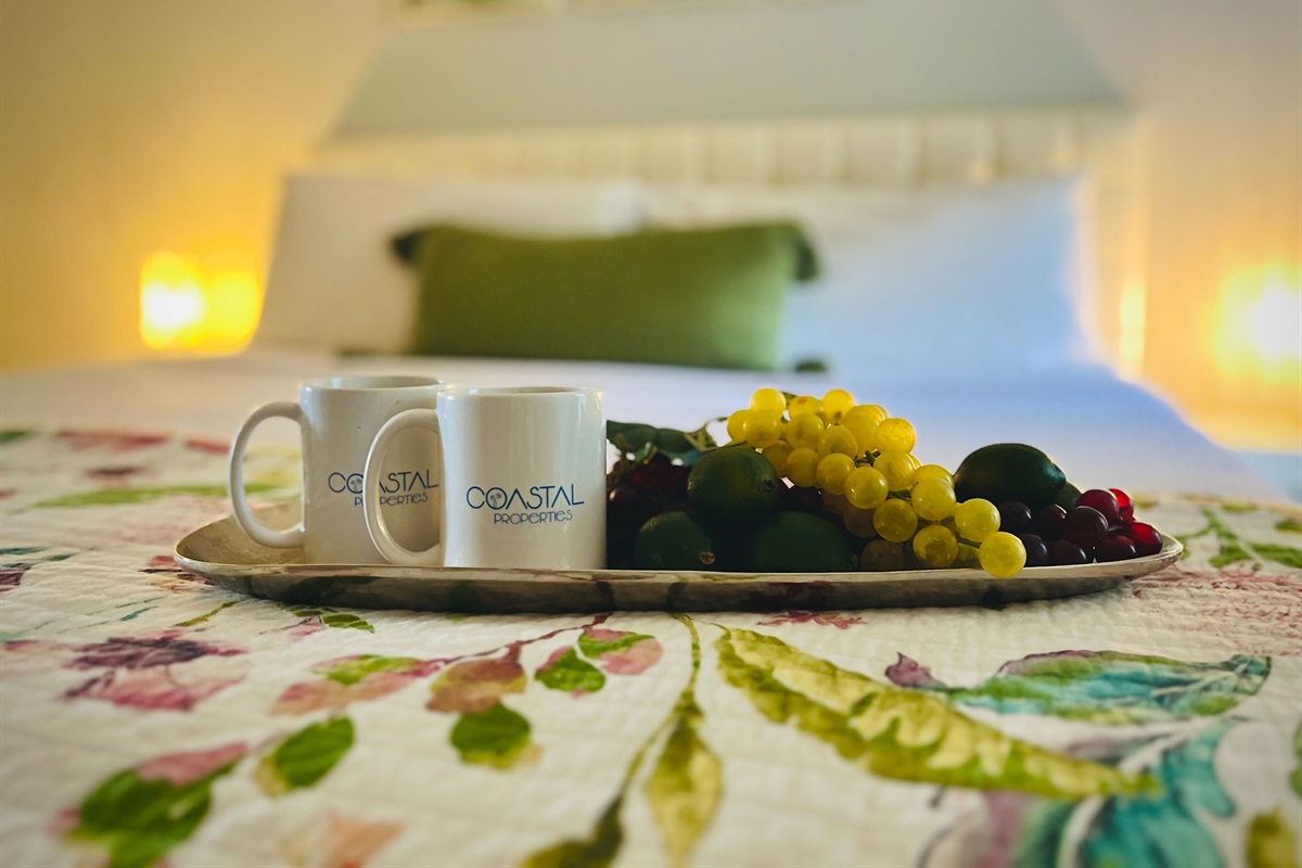 Discover charming coastal decor accents that adorn the bedroom, seamlessly blending the indoor space with the beauty of the ocean just beyond.