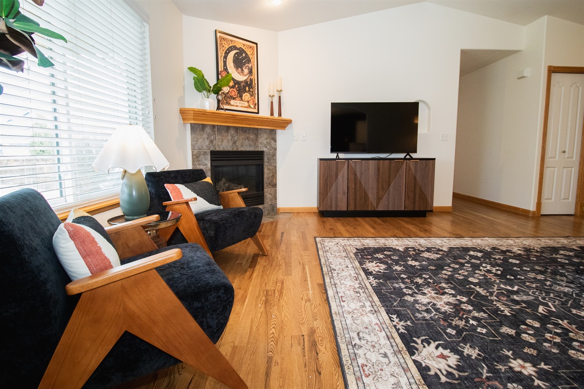 Large TV and fireplace setting