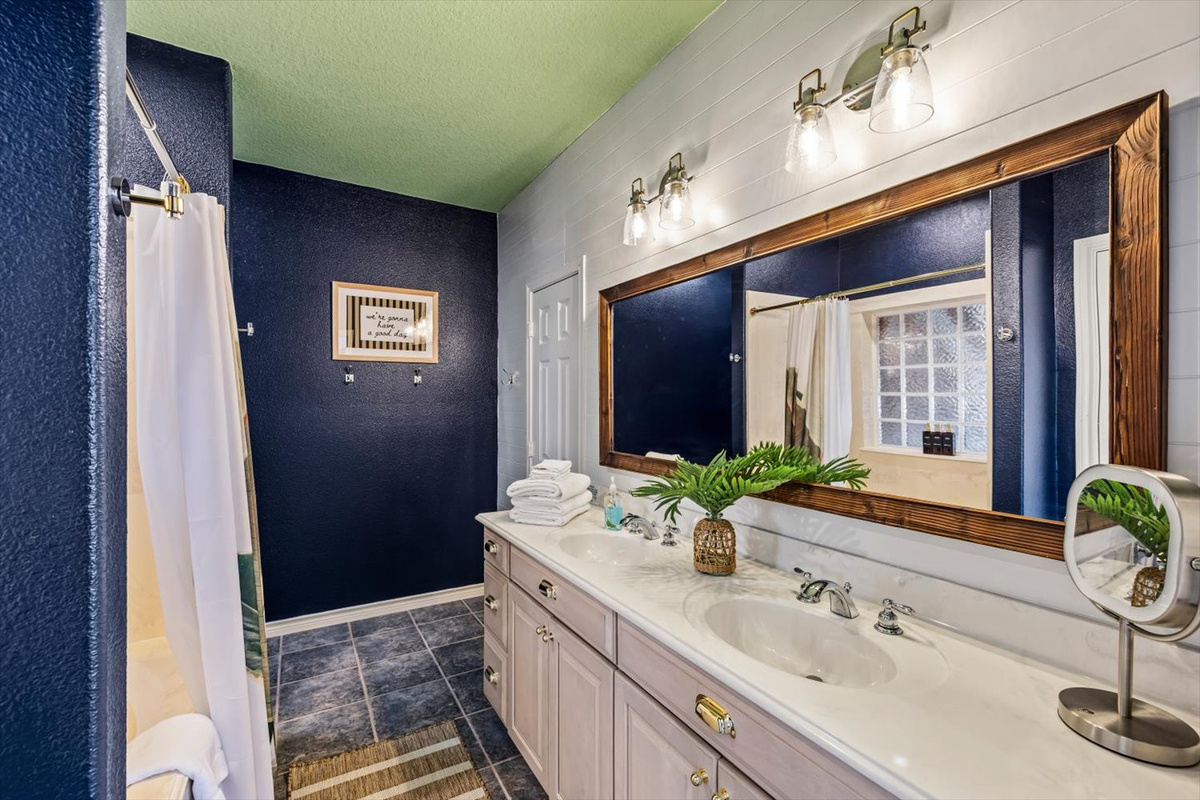 Double vanities with tub shower combination, walk in closet. And the kid tent play space is located in the walk in closet for fun for the littles! 