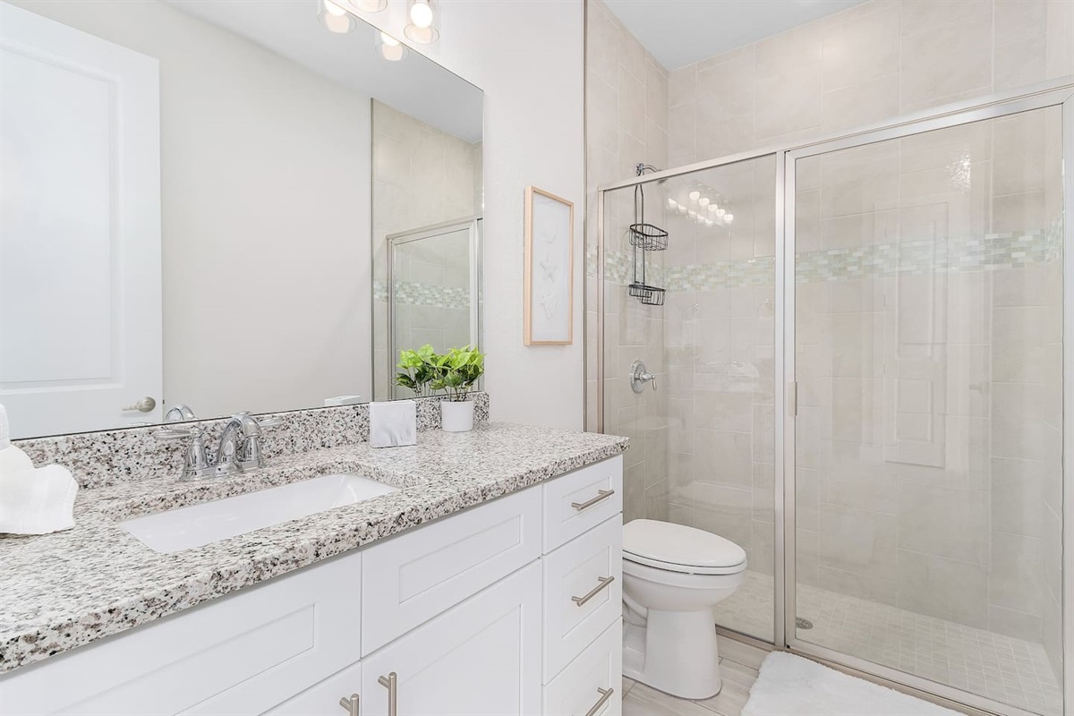 Experience luxury in the stunning guest bathroom featuring a beautiful shower! 