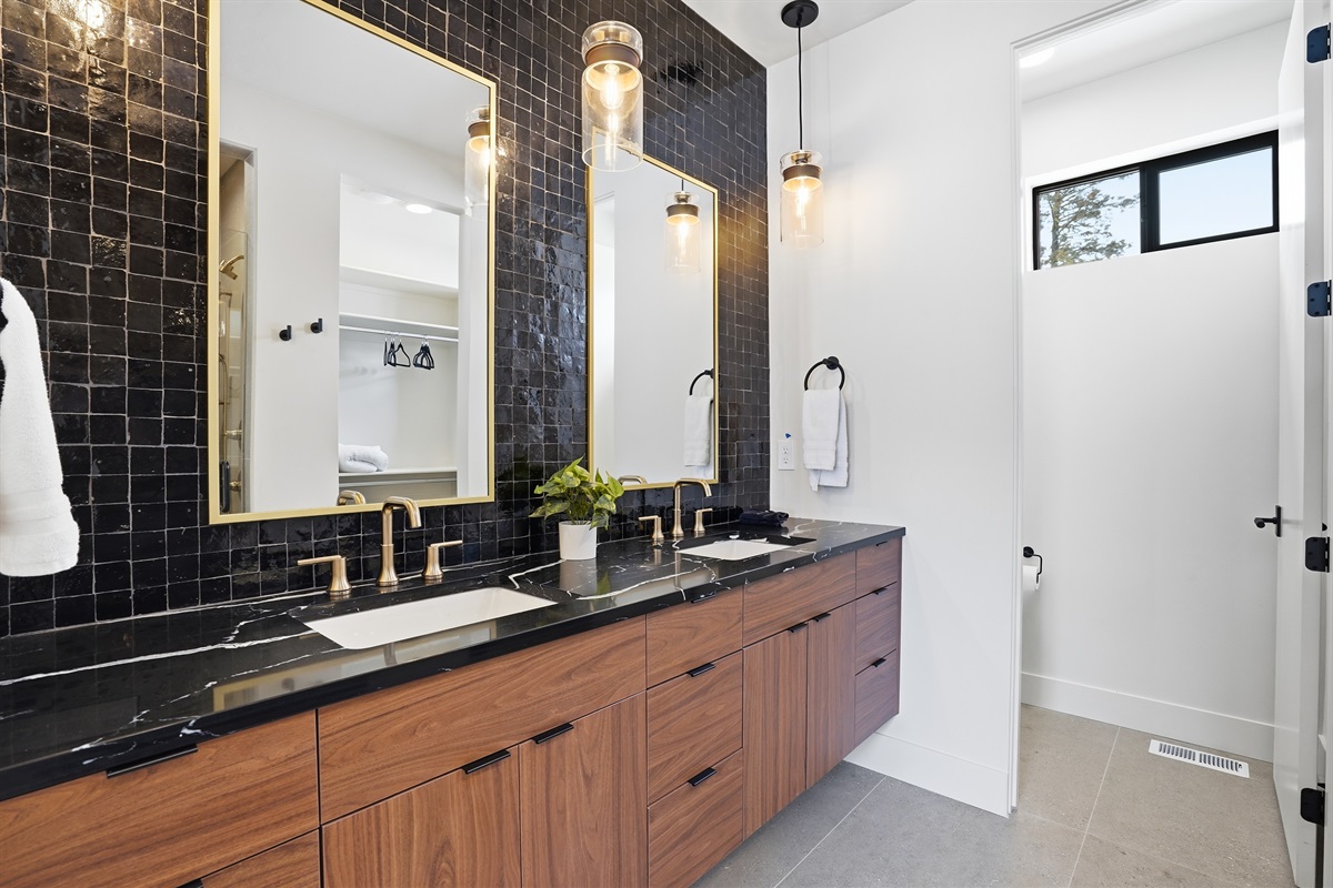Modern Double Vanity Featuring Elegant Gold Designer Fixtures