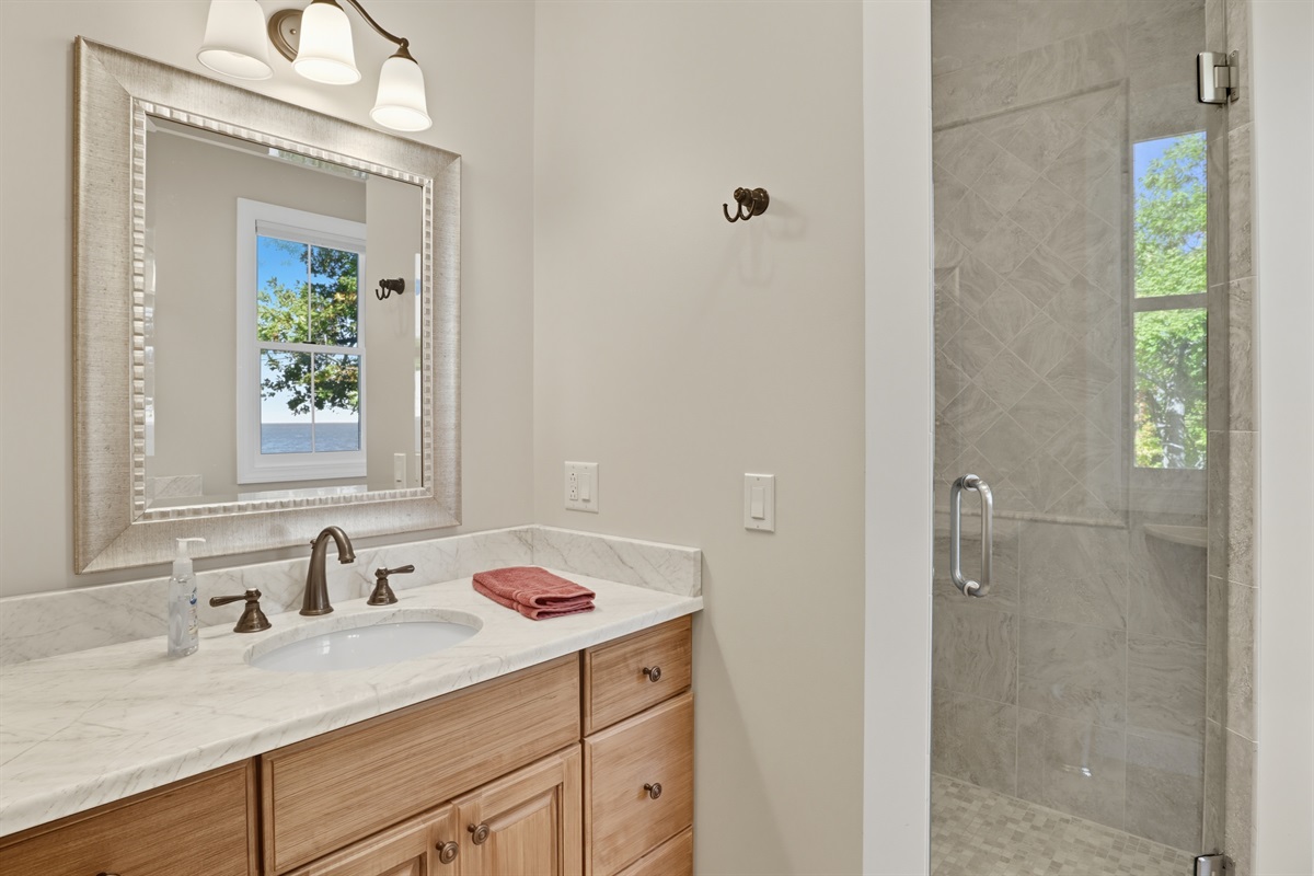 Modern master bathroom with double sinks and walk in shower. Bathroom #1