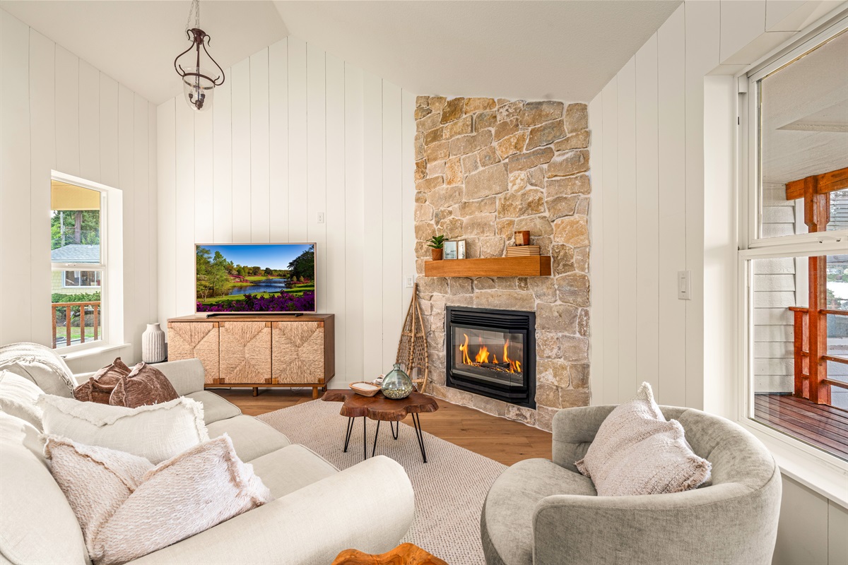 True limestone fireplace surround and shiplap provide the quintessential modern cottage experience!