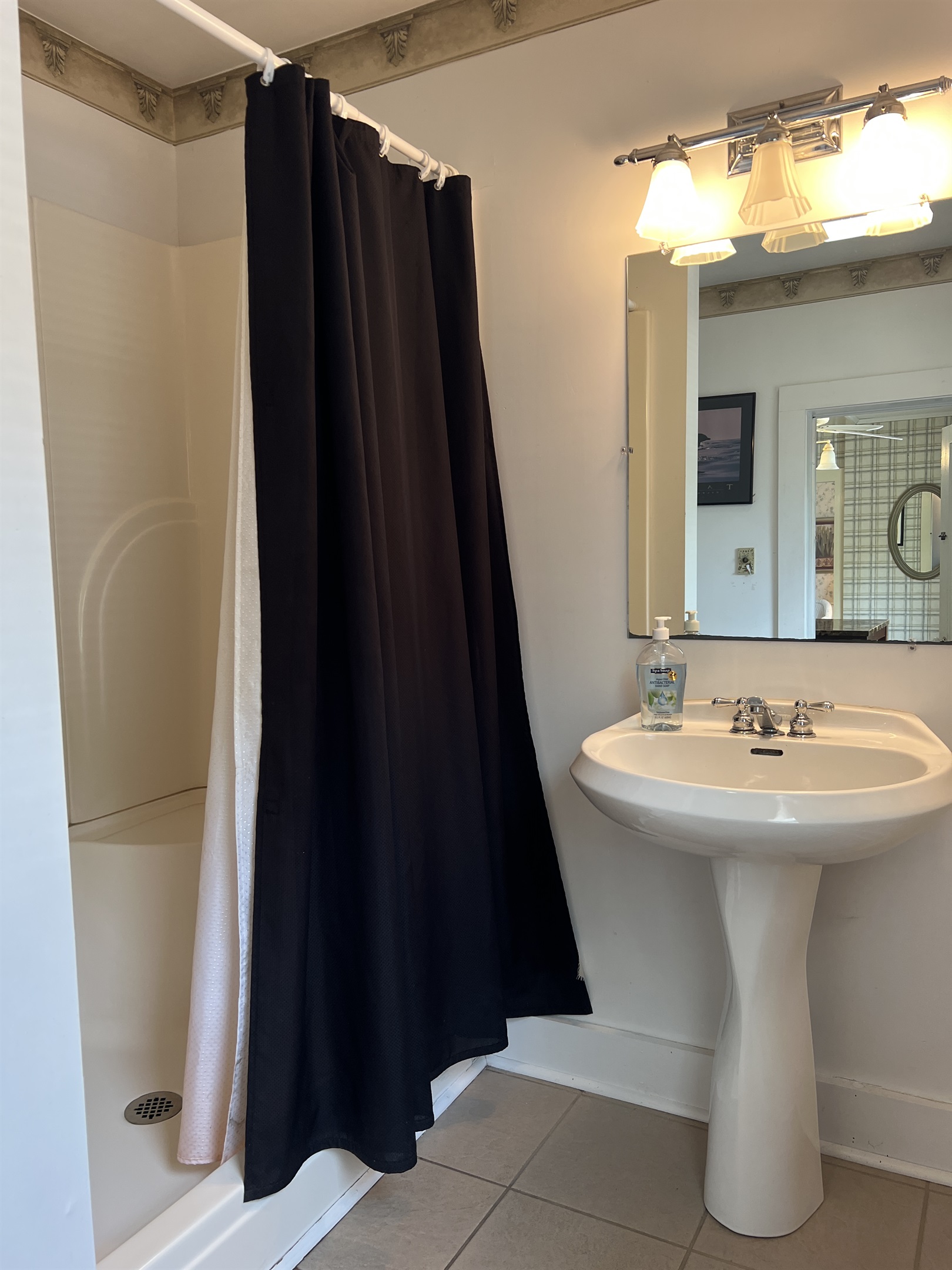 The Federal House 1st floor common bathroom with shower. Located just off kitchen and exit to the pool.
