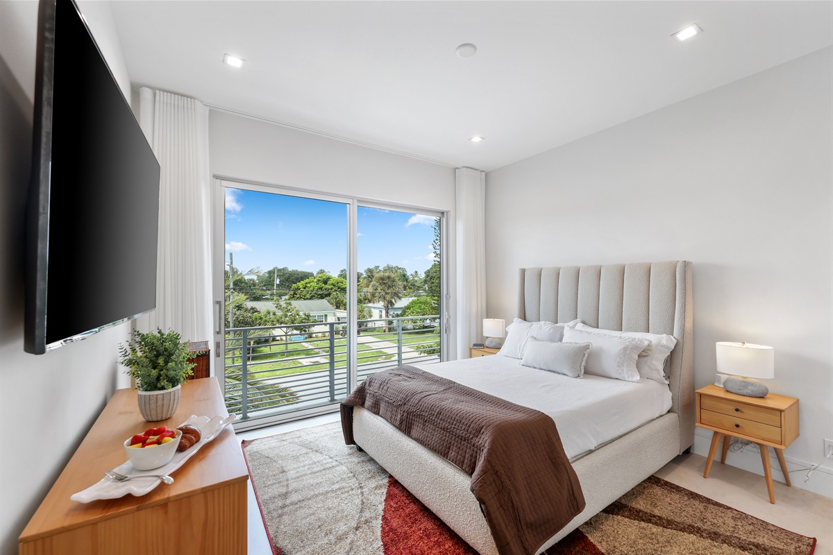 queen bed, private balcony, ensuite bath, and generous closet space.