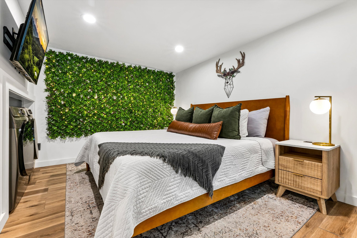 Master Bedroom with King Bed, 42-inch Smart TV, sound machine, blackout curtains and desk with computer monitor.   Full size washer/dryer with detergent provided.