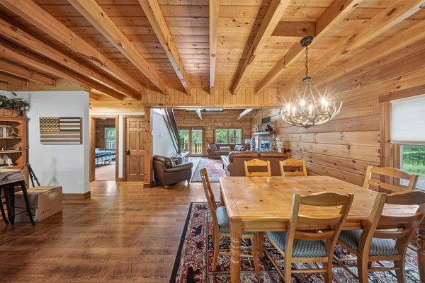 Dining area with seating of 6 at the table and an additional 4 at the kitchen island bar, just steps away.