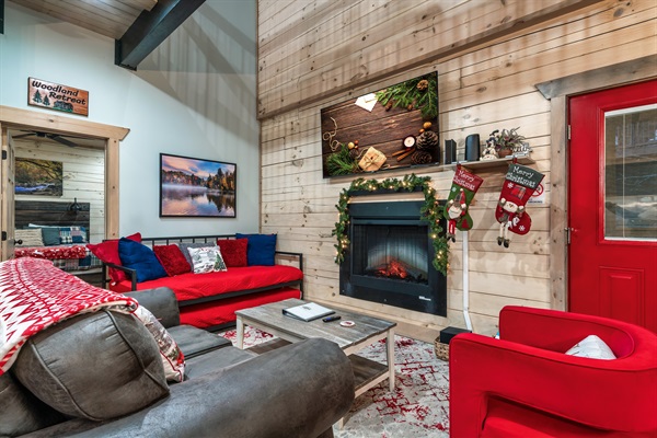Living Room Retreat: Relax by the festive fireplace in vibrant, inviting seating!