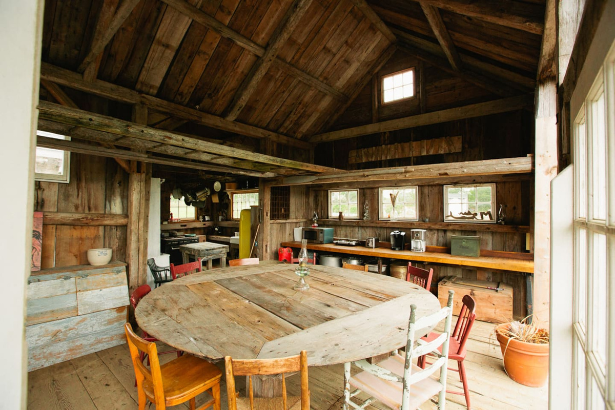 Butcher's wheel dining table. Seats 20. Overlooks terrace.