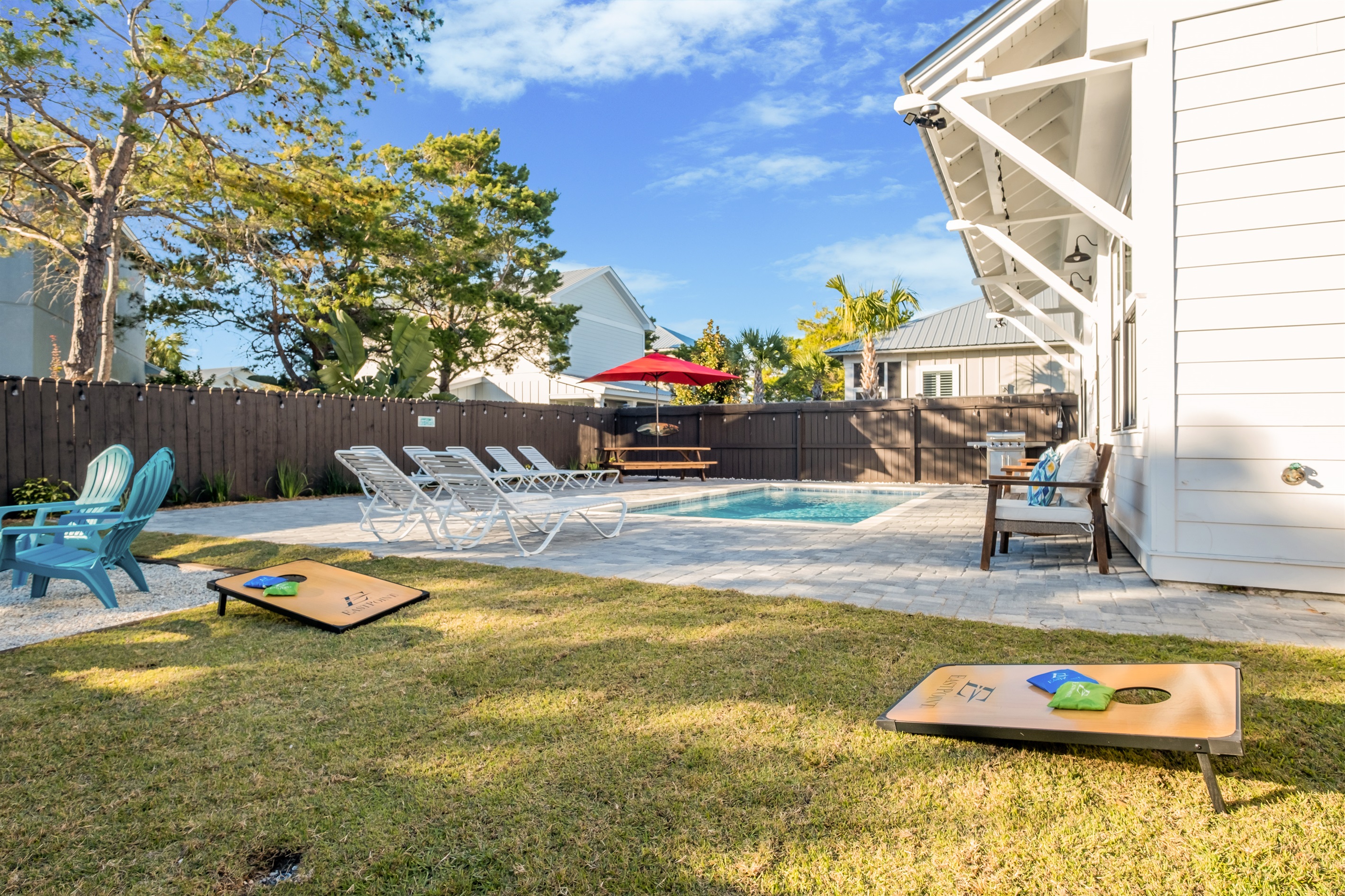 Play a game of corn hole in your backyard oasis