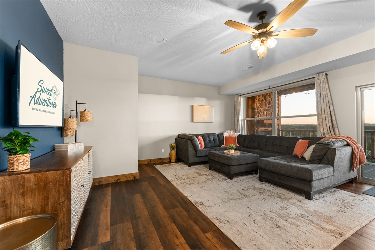 Living room flooded with Ozark sunset light—built for cozy nights in.