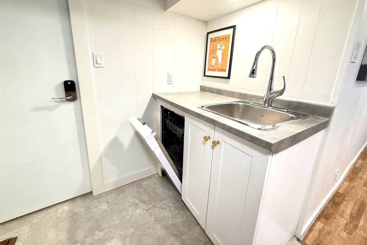 Sink with dishwasher for easy clean-up during your stay.