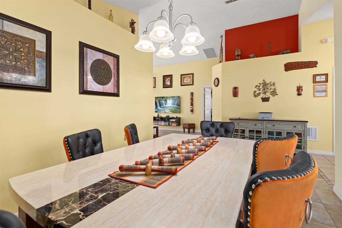 The dinig room is open to the living and maintains the fun colors of the villa!