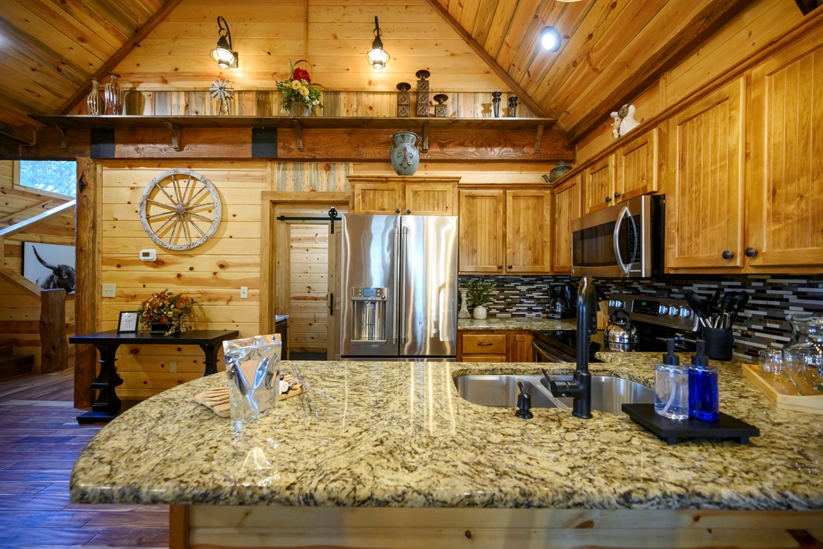 Fully stocked kitchen with 4 bar seats