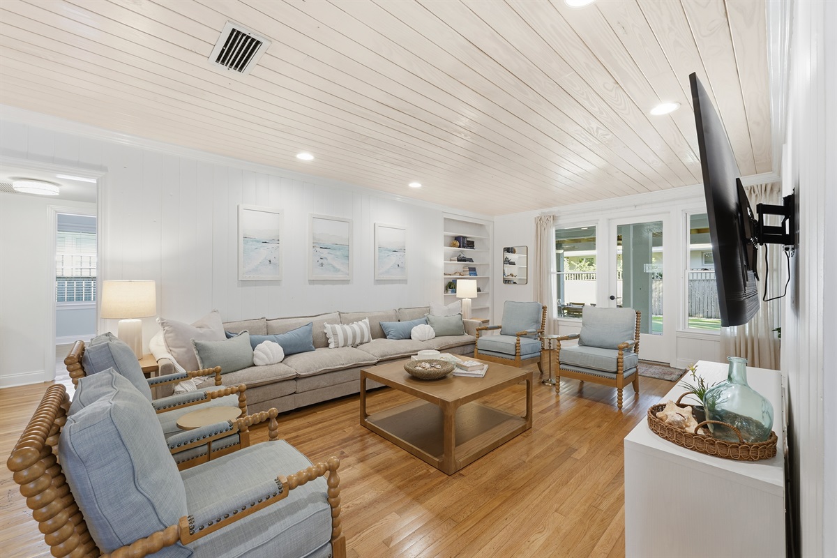 Spacious coastal living room with plush seating and plenty of room for everyone to unwind.