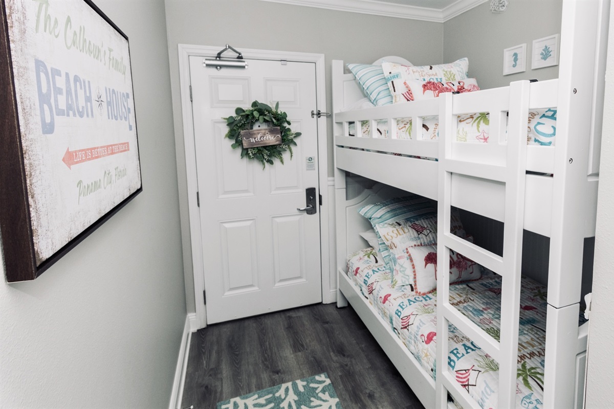 Entrance into The Crabby Shack! Freshly painted bunk beds that sleep 2. Look at those new comforter's. The colors are so bright and vibrant. 