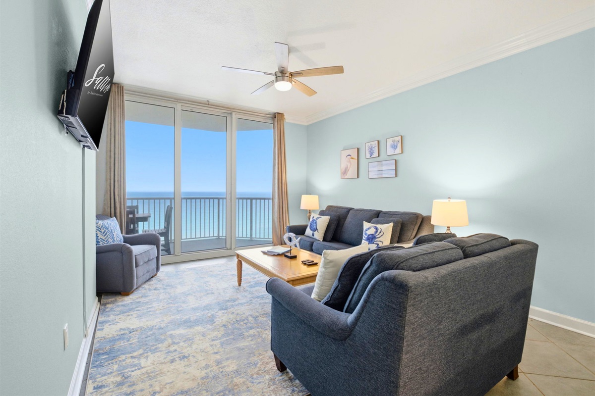 Kick back on the comfy seating while enjoying beautiful water views through the sliding glass doors.