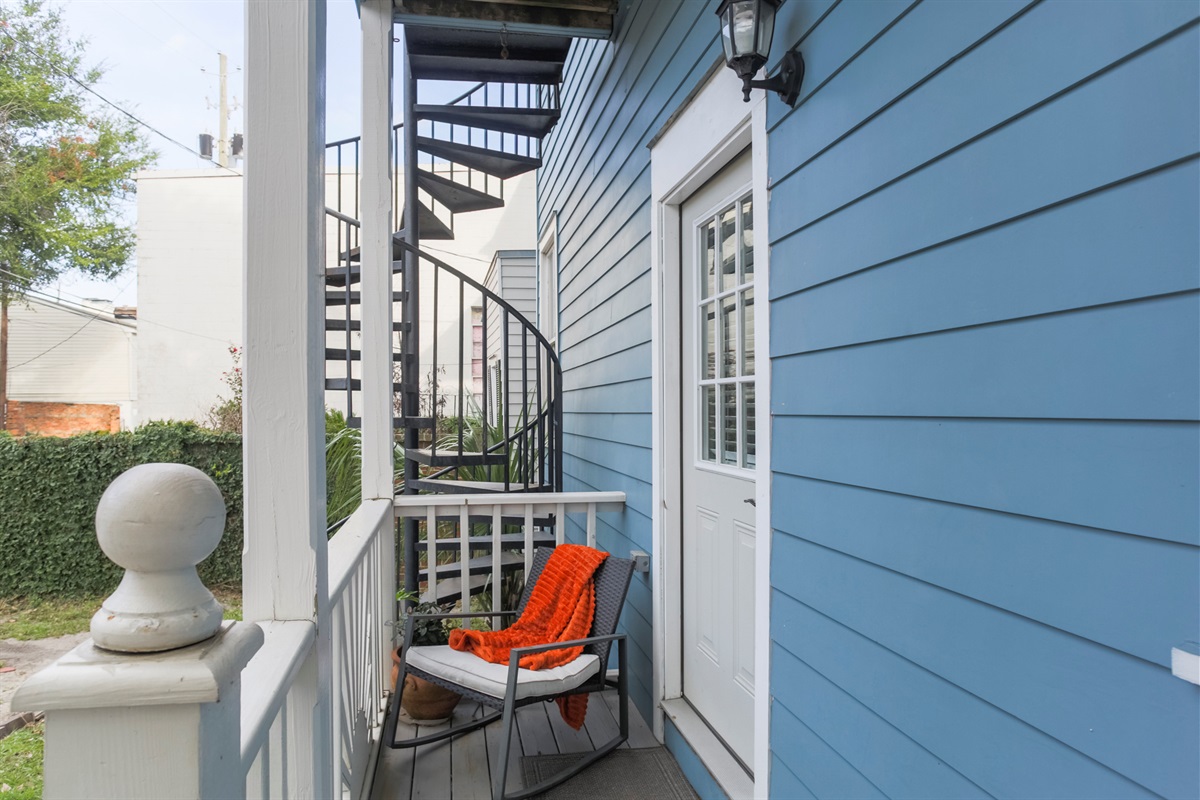 Step out to the quaint back porch—perfect for a quiet moment with your morning coffee