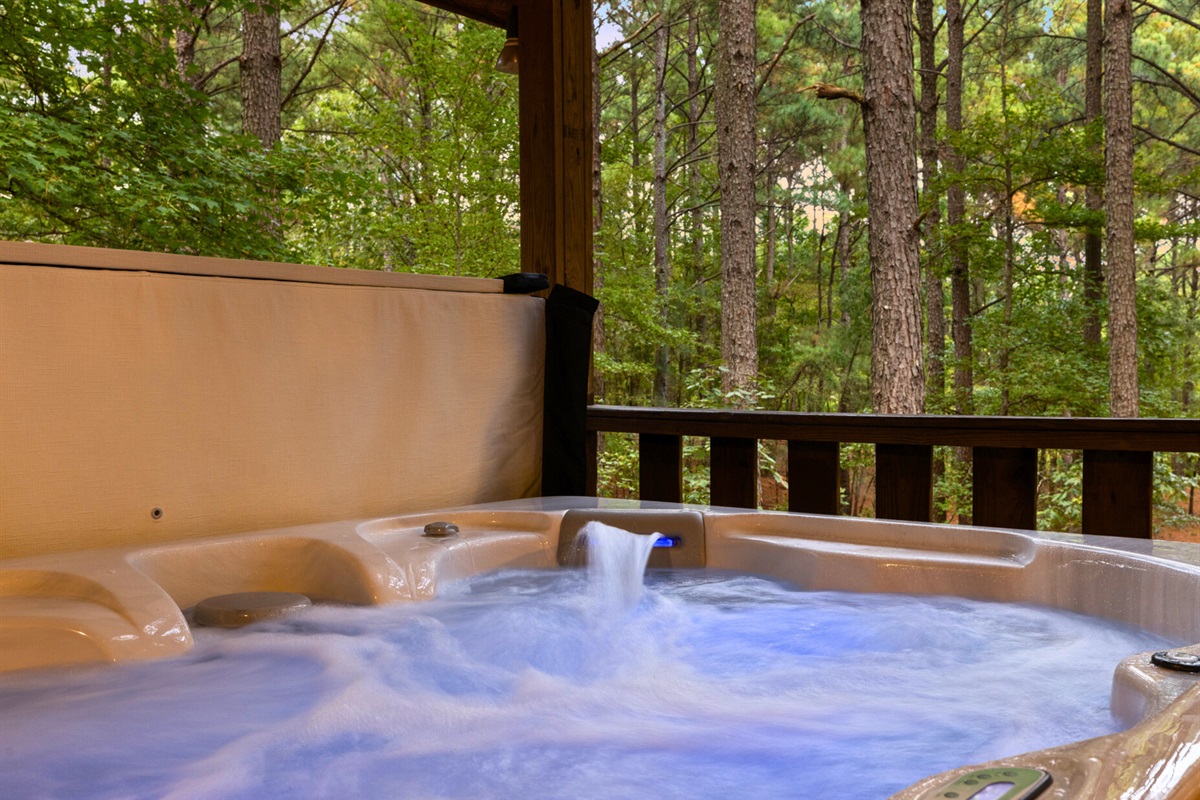 Relax in your private bubbling hot tub surrounded by forest serenity