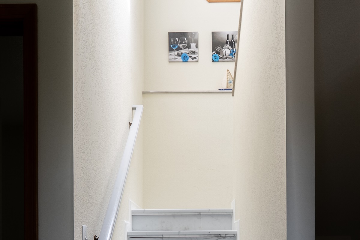 Access the home through this marble staircase with sleek trim.