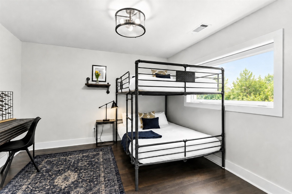 Pick a bunk, open the laptop, and you're done &mdash; the second bunk room doubles as a workspace so someone can actually get things done.