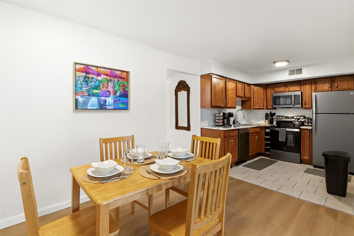 Sleek dining table, beautifully set for your stay.