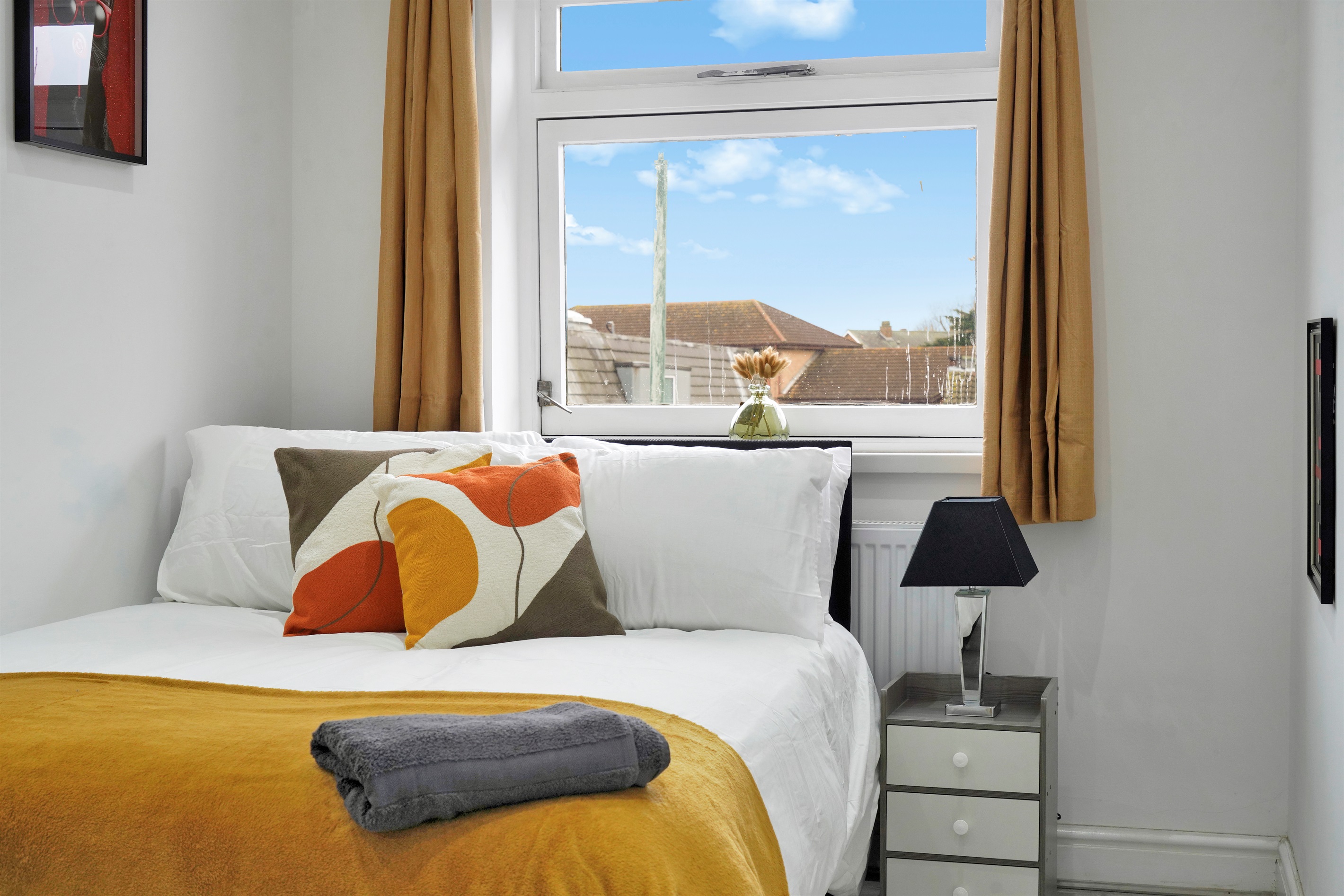 [calm sleep setup, bedside lighting, privacy curtains, fresh linen]