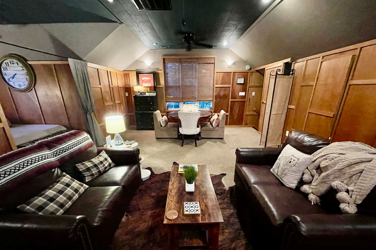 Pair of leather sofas covert to comfy twin beds. Open and airy space with room for dining, relaxing or working. 