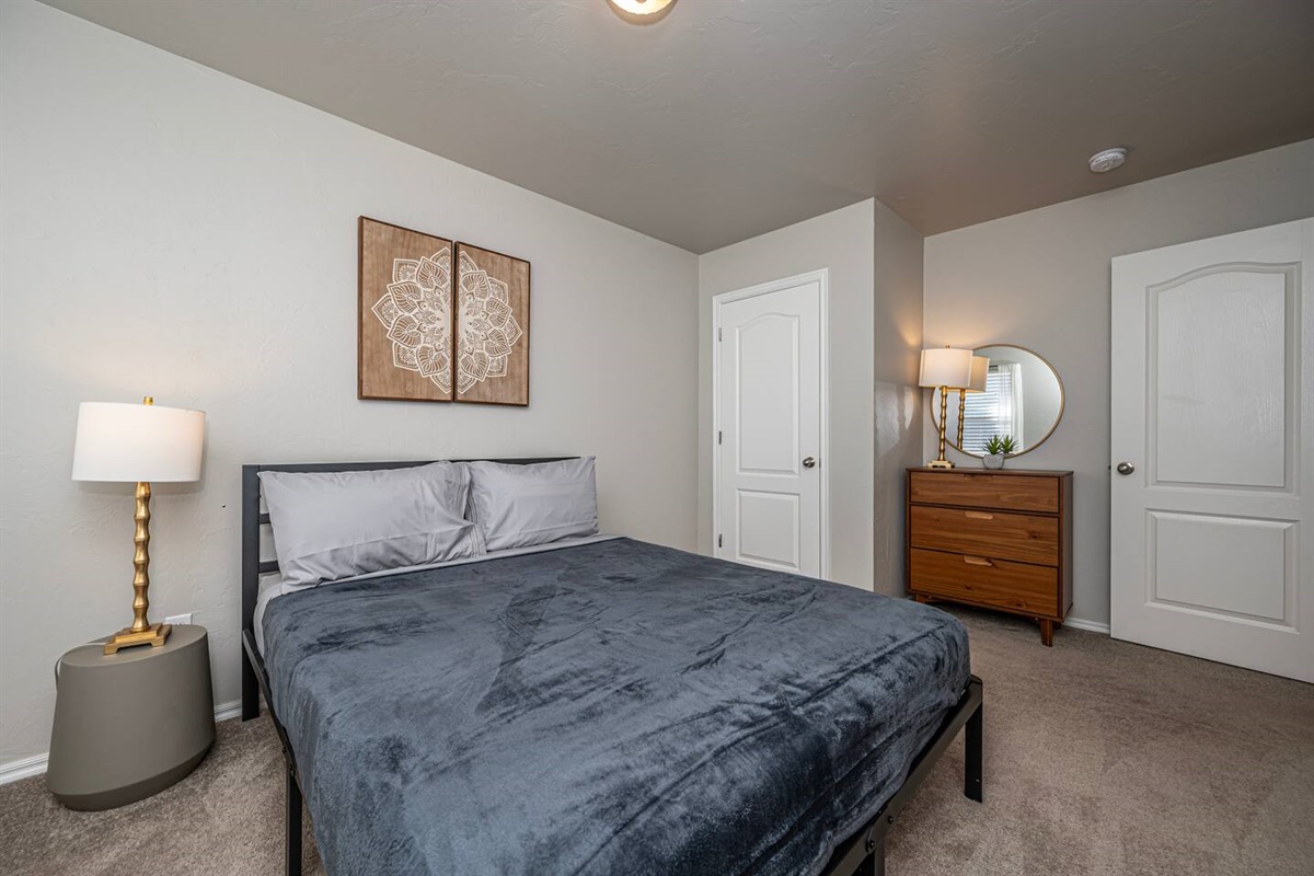 Secondary bedroom featuring a restful queen bed for a great night’s sleep.