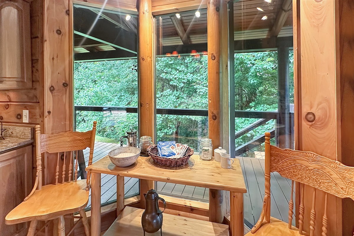 Breakfast Nook: Enjoy morning coffee amid tranquil forest views and delightful rustic charm!