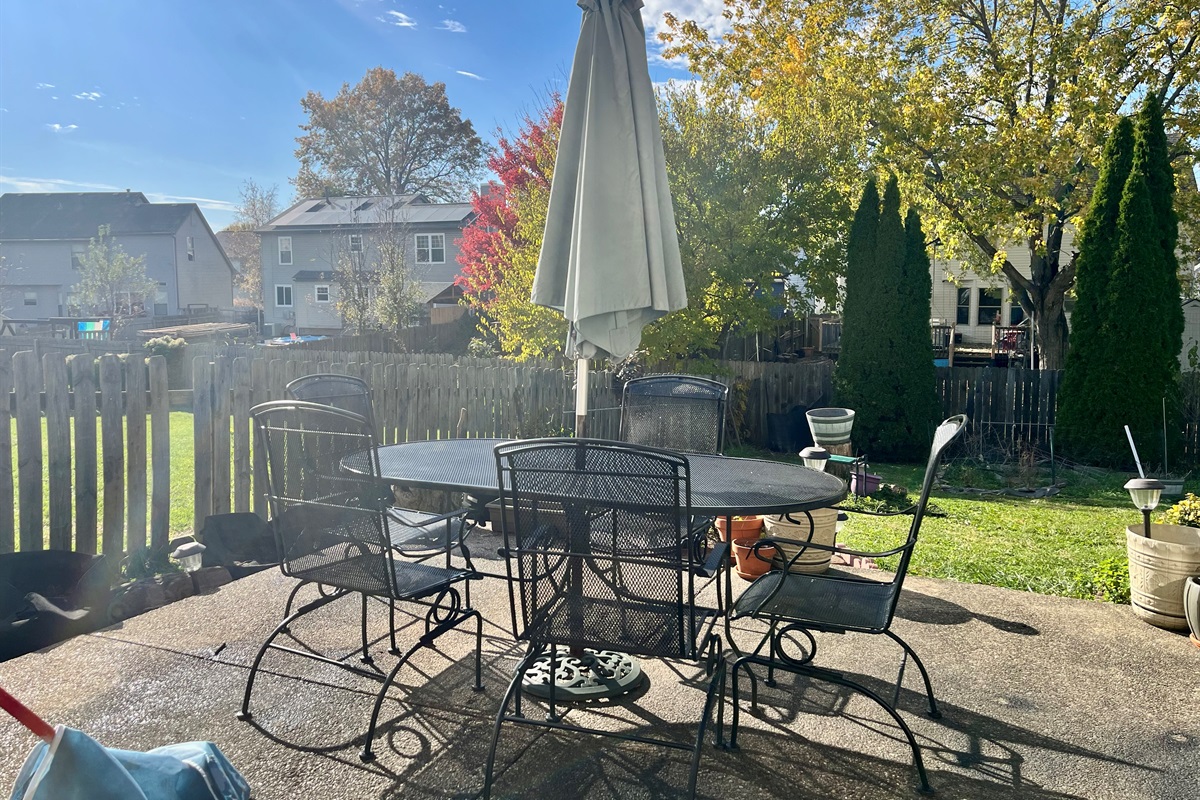 Patio has a gas grill and outdoor table