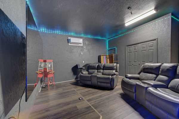 Fully air conditioned game room w/ karaoke stage, 85" TV, and plenty of seating