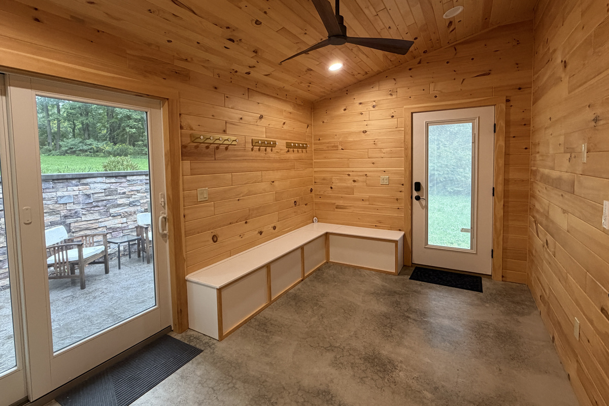 Mudroom off kitchen with sliders to back patio