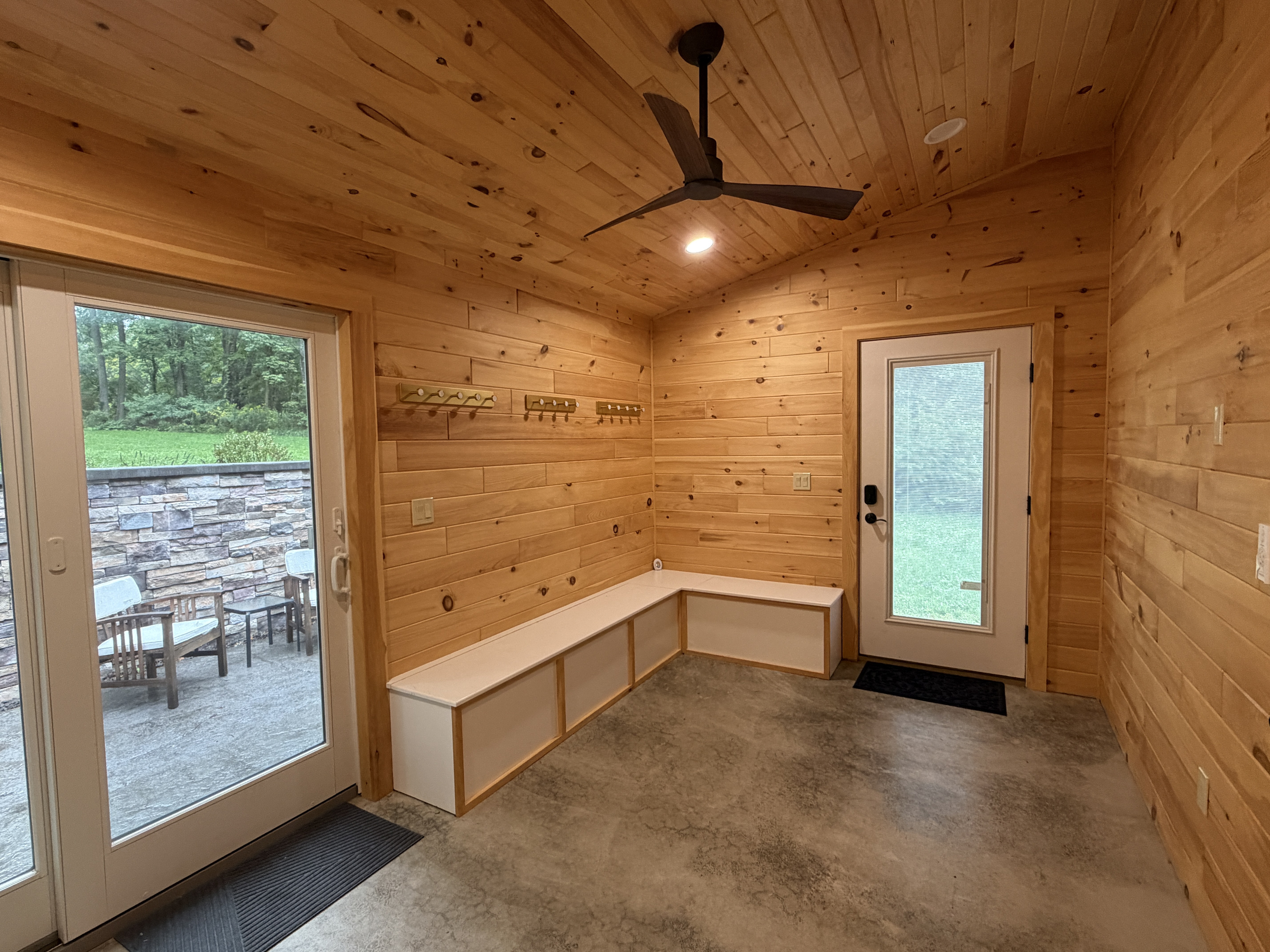 Mudroom off kitchen with sliders to back patio