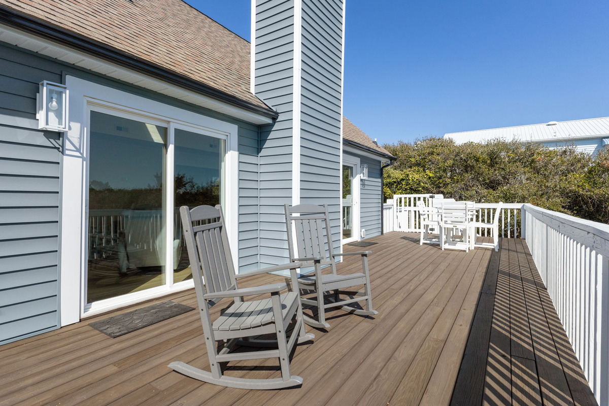 Rocking chairs provide a peaceful spot to relax, read a book, or watch the sunrise and sunset