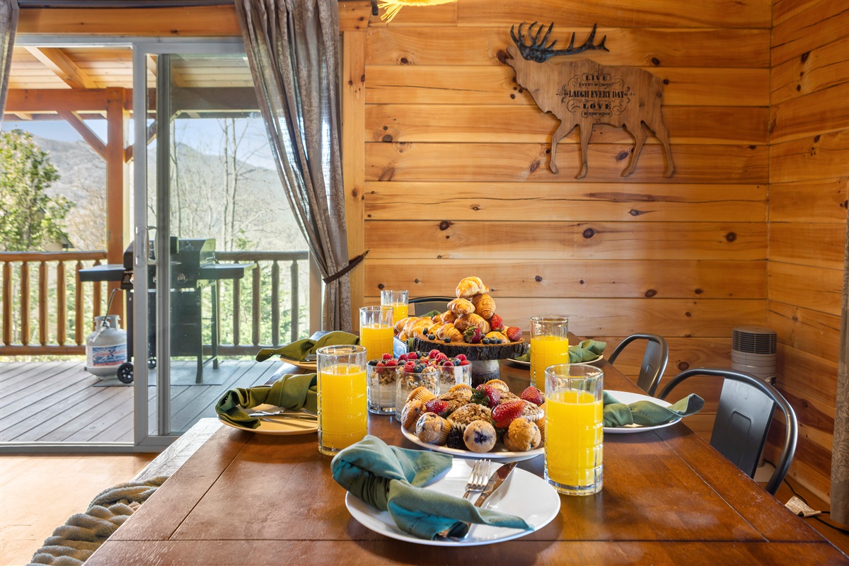 Dining Area: Savor delicious meals with mountain views and rustic charm at this inviting table!

