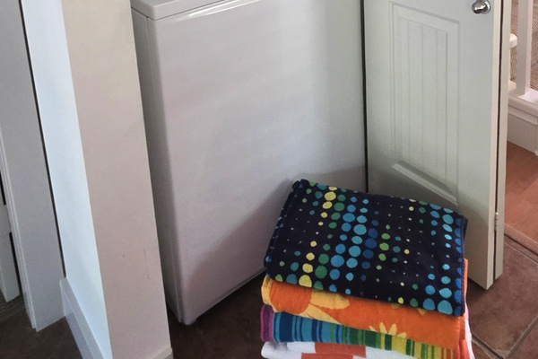 Stackable washer and dryer - dont worry we stock with laundry pods and dryer sheets. There is also a iron board and iron.