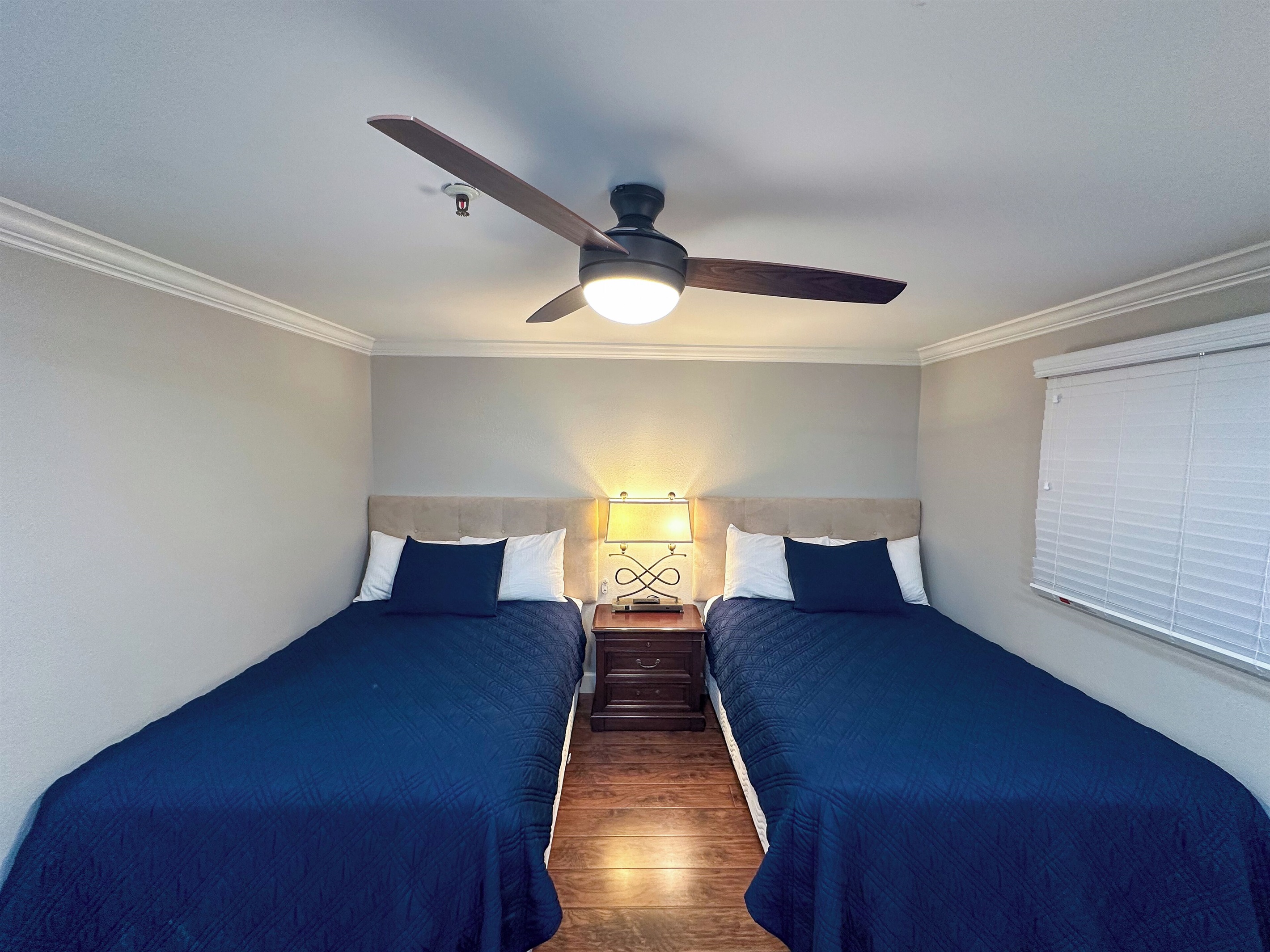 Two double beds with Beautyrest mattresses in the second bedroom.