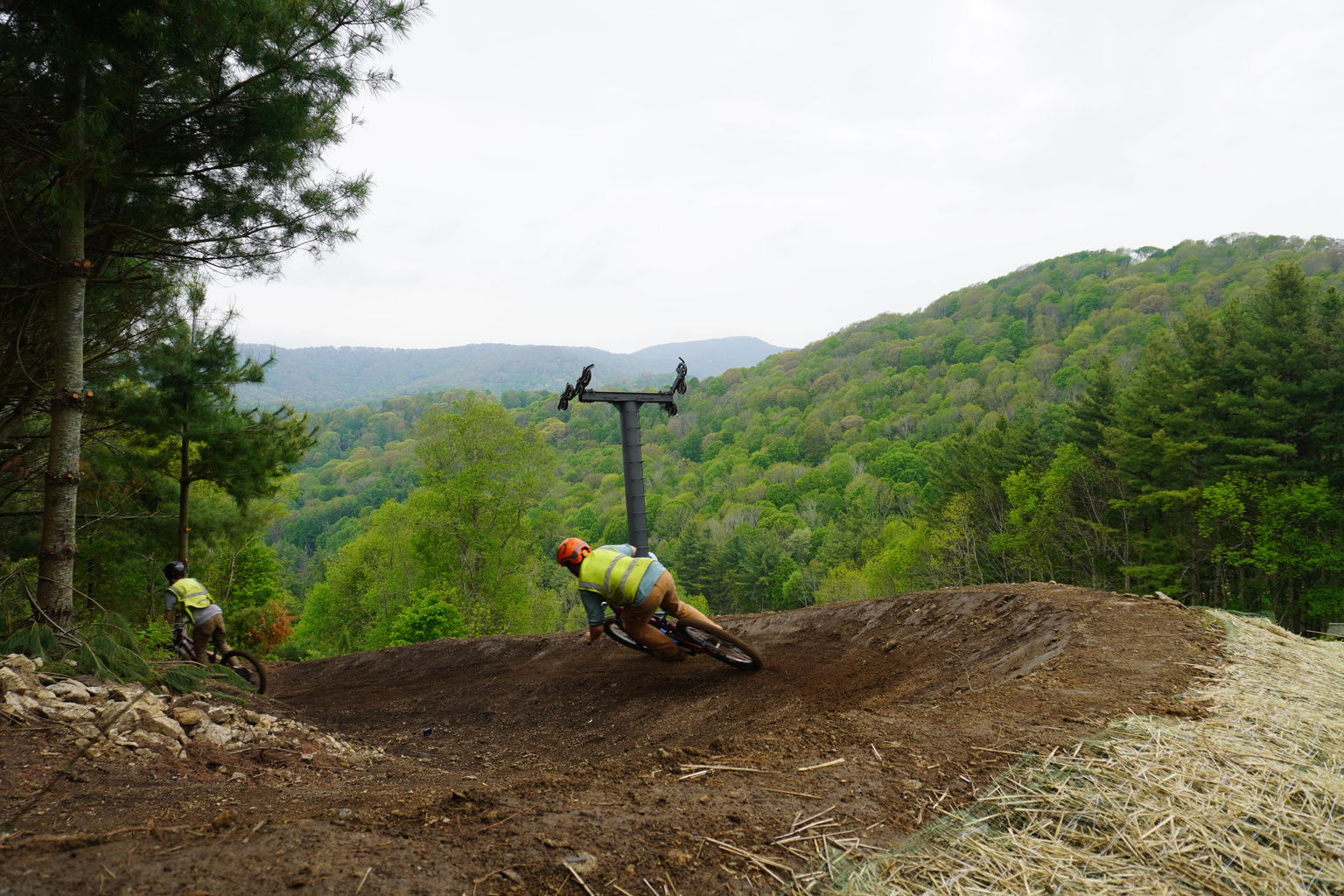 Mountain bikers riding at Hatley Pointe Bike Park near Mars Hill Haven